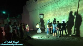 بصمة فنية يرسمها اعضاء لقاء الشباب الجامعي في القوش على جدار مار ميخا